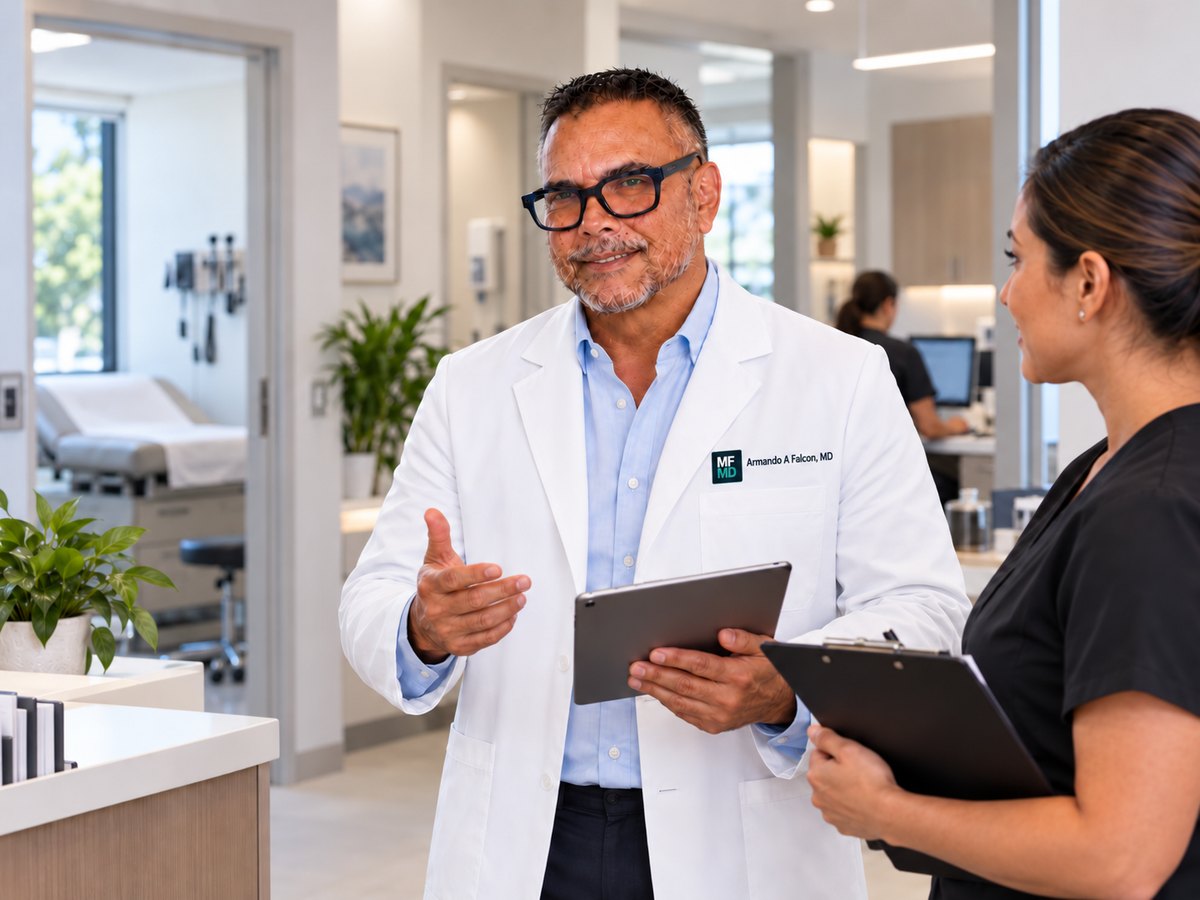 Dr. Armando A Falcon, MD, in clinic with a member of his clinical team
